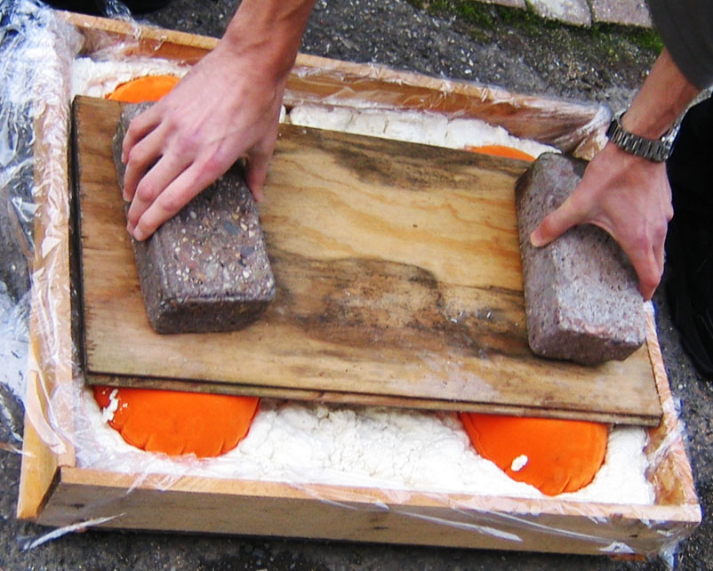 Apply pressure during curing of the foam
